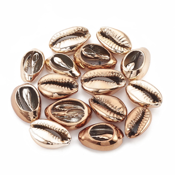 Cowrie snäckor utan hål varm guld