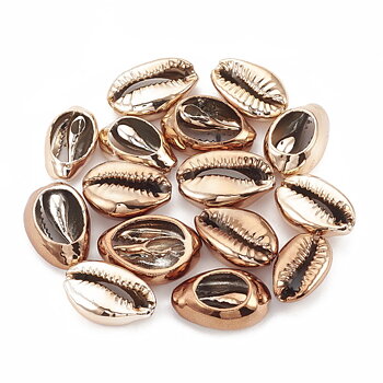 Cowrie snäckor utan hål varm guld