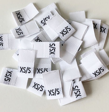 Vit  vävd vikt storlekslapp XS/S - 2