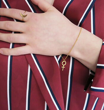 Armband kvinnotecken guld