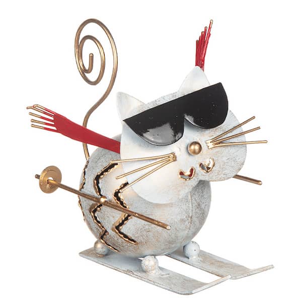 Dekorationsfigur av en katt på skidor i hamrad plåt, 12 cm, med detaljer i vitt, rött, svart och guld