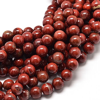 Runda 10 mm pärlor av naturlig Red Jasper i djupt tegelröda och brunröda toner, visade i närbild på flera strängar med glansig finish