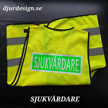 SJUKVÅRDARE Reflexväst  gul med grön platta och vit text SJUKVÅRDARE   