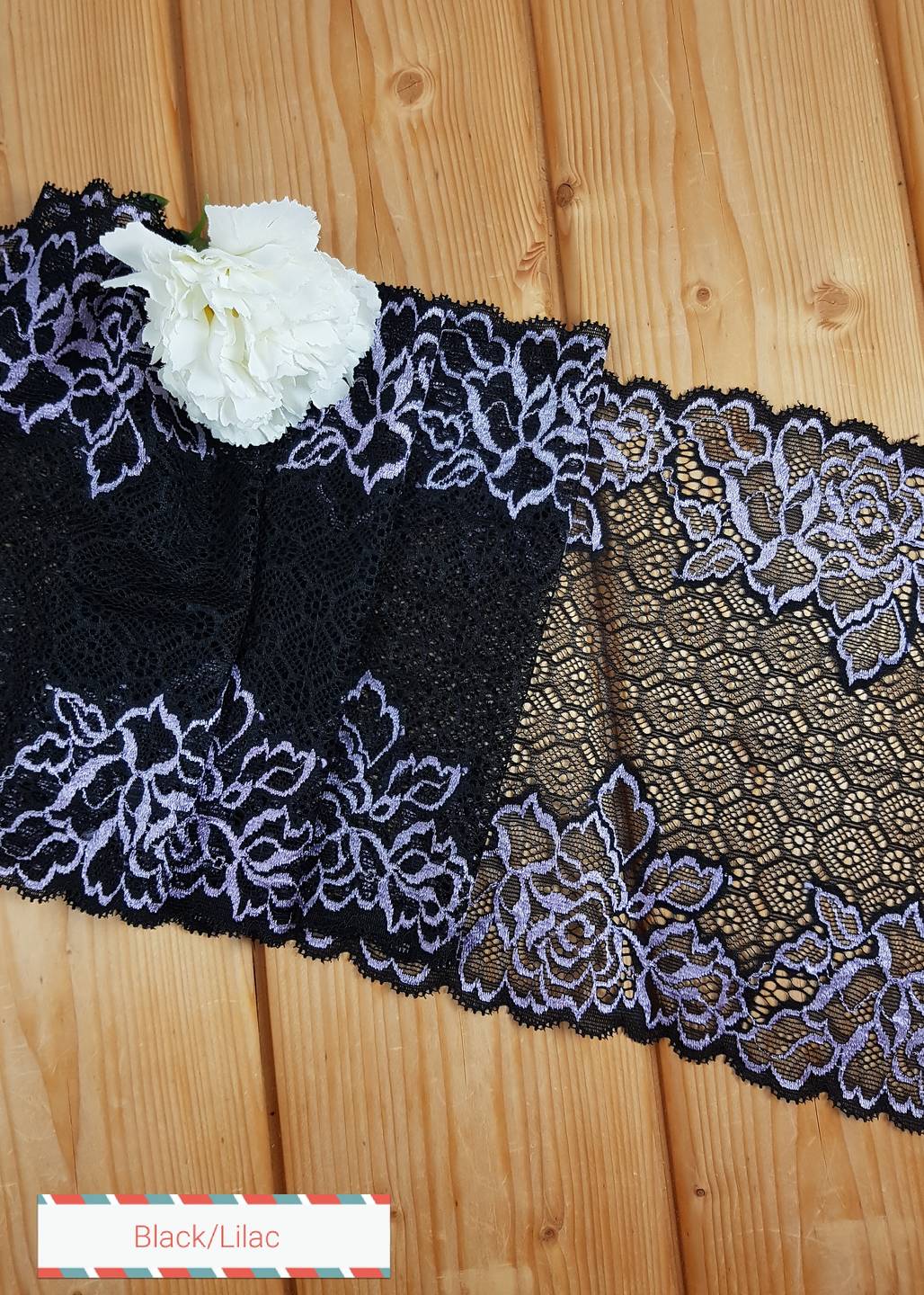 Black stretch lace with decorative lilac flowers - 19 cm