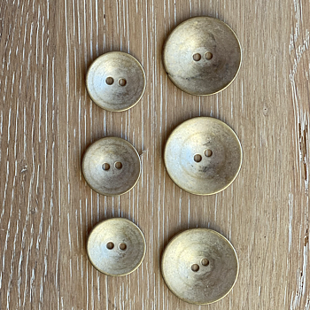 Metallknappar, champagnefärgade 18 och 23 mm