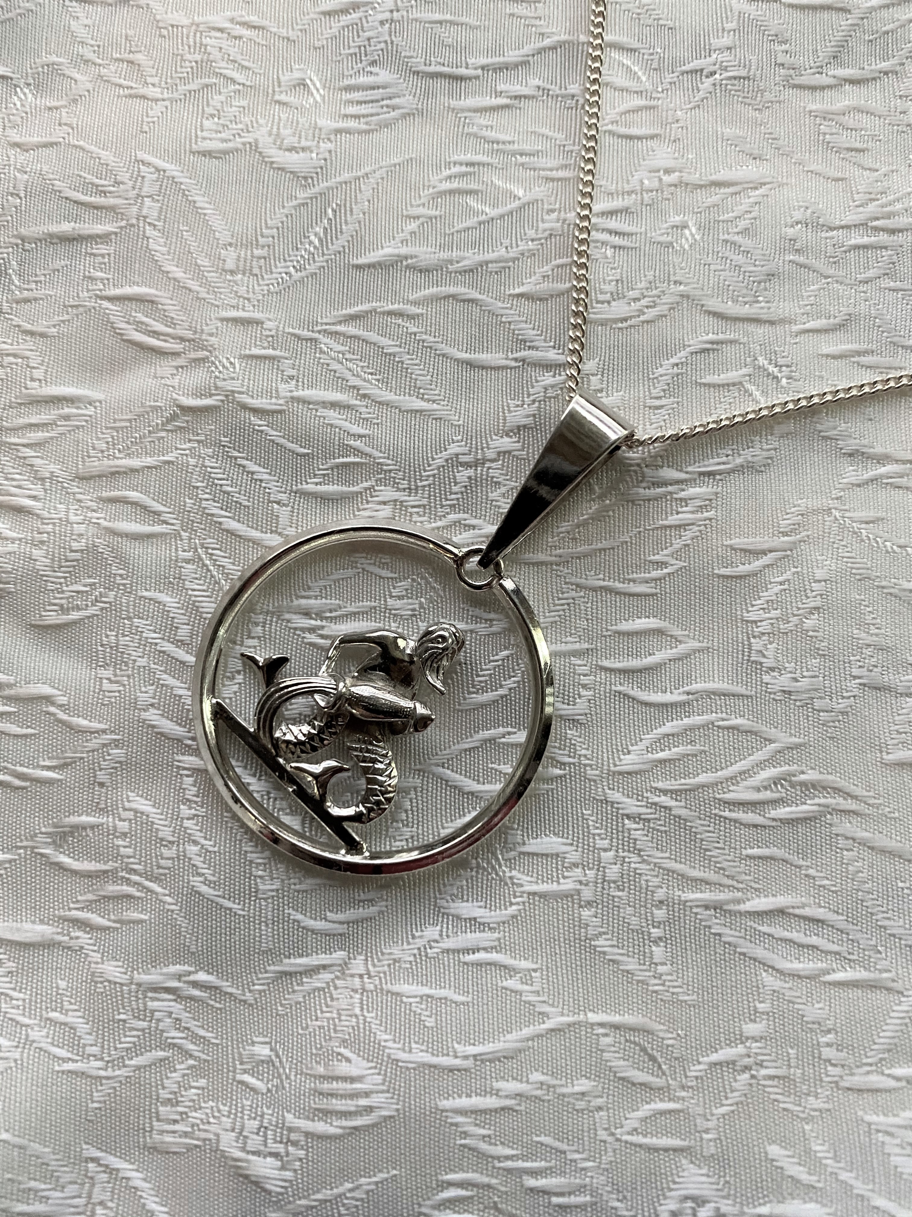 Vattumannen i äkta silver från-70talet.  Stjärntecken. 30X30mm