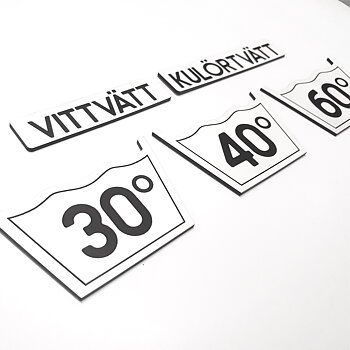 Tvättsymboler, graverade Vita Akryl Gravyr