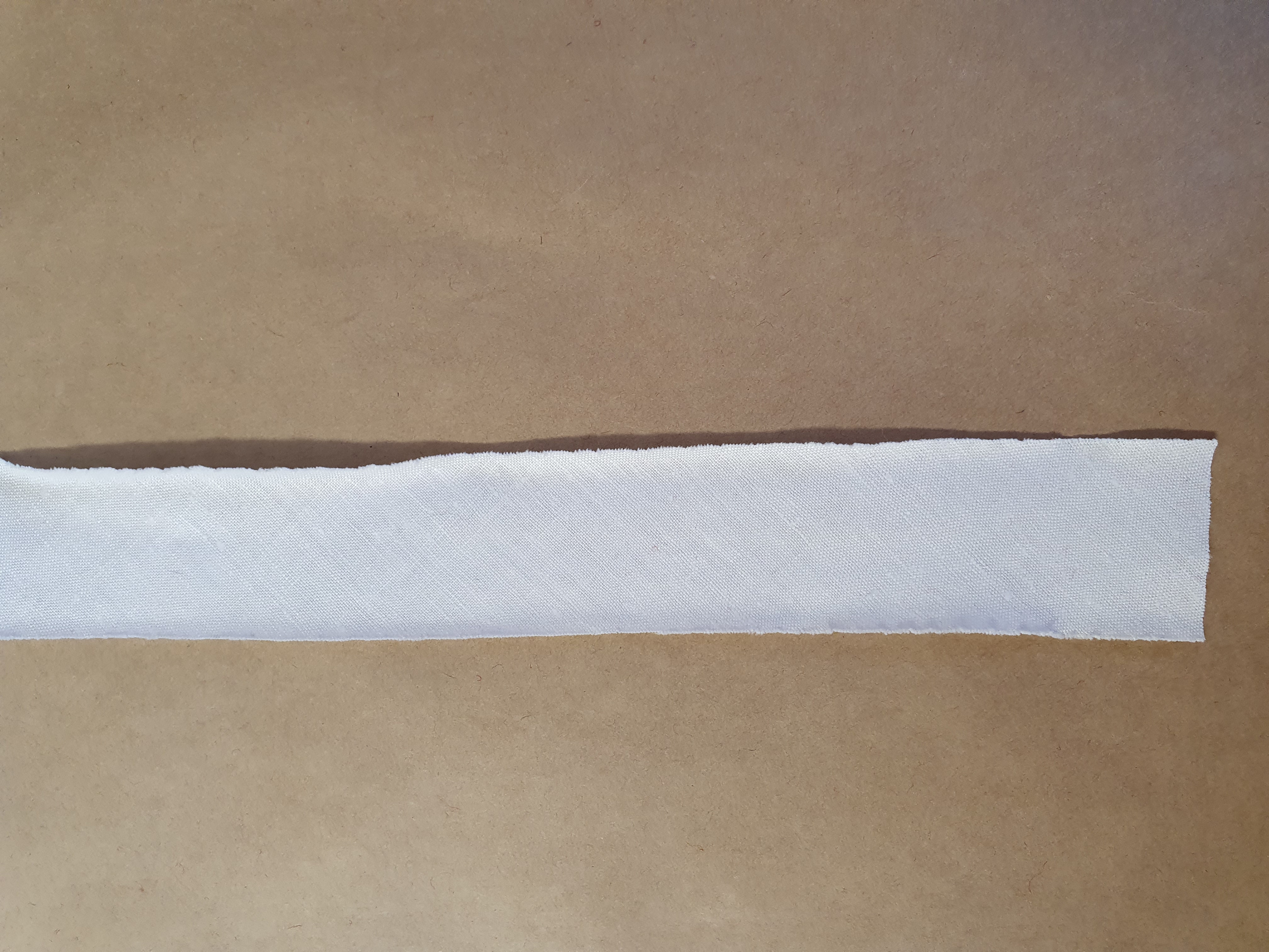 34 mm snedskuret bomullskantband ovikt fg vit