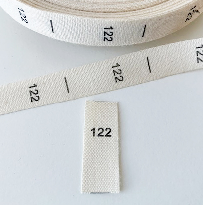 Printed cotton label to fold, size 122