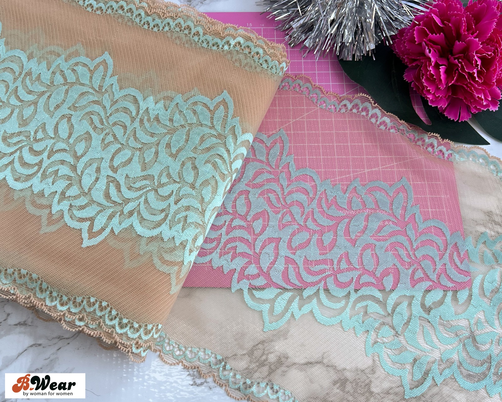 Beige stretch lace with mintgreen decorations 