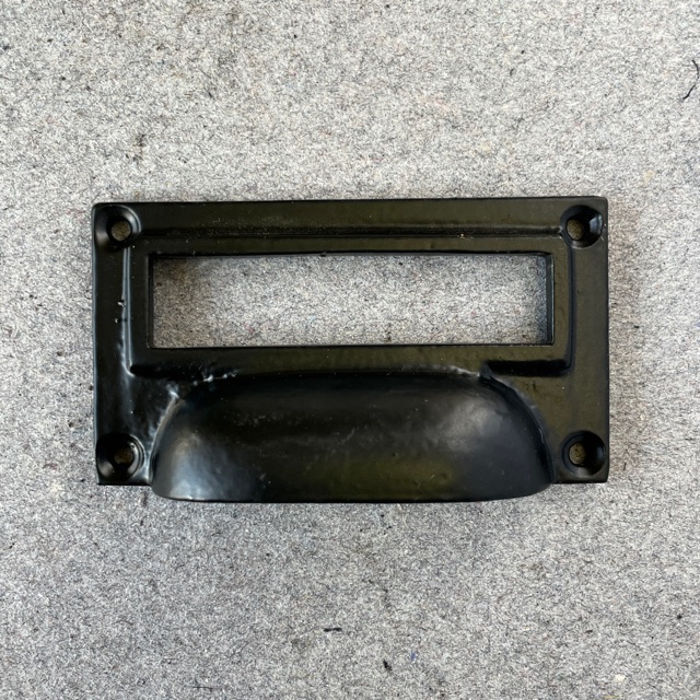 Etiketthandtag svart