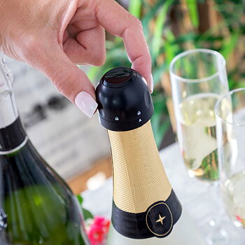 Champagne-stopper på en flaska champagne