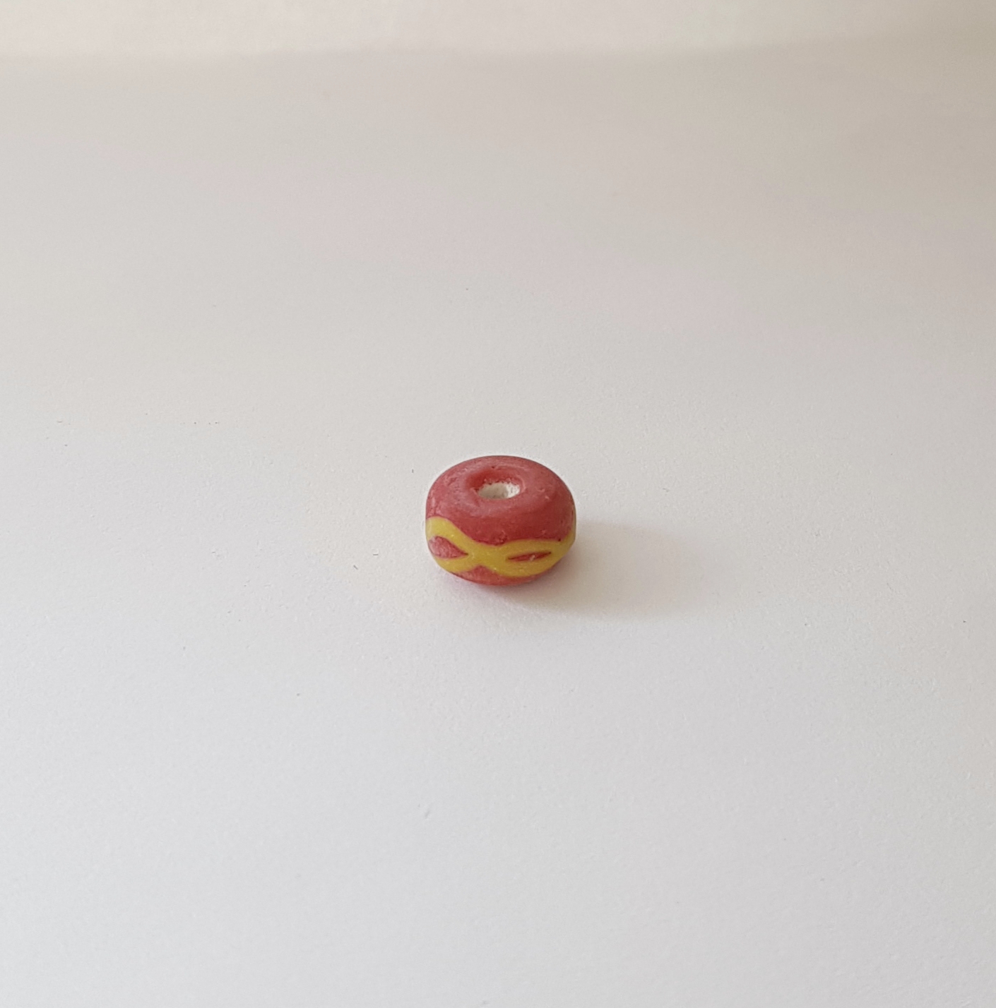 Rödorange pärla 6x10mm