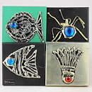 Sven Lindström (1970s) Four Wall Plaques with Tin Motifs 10 cm