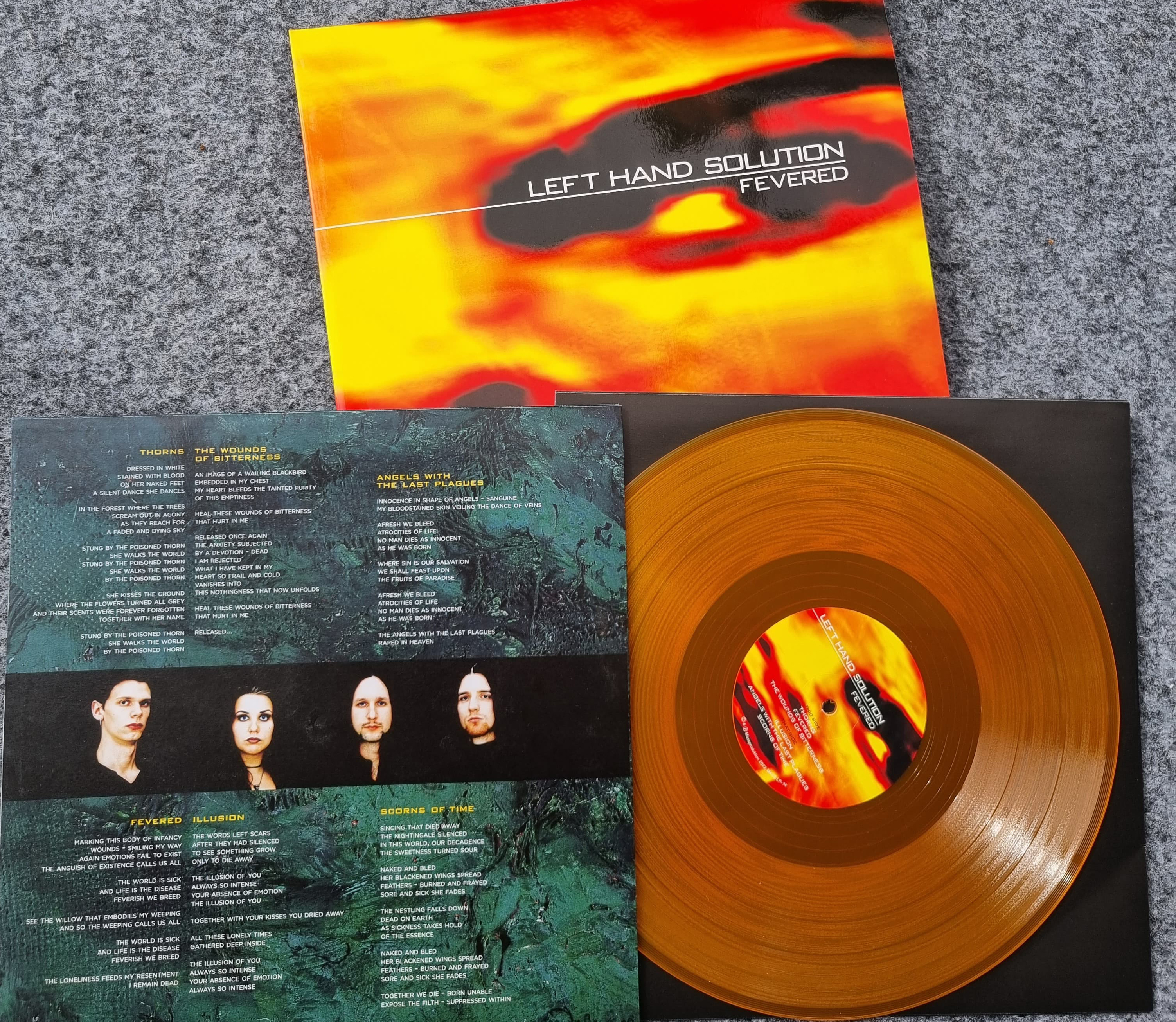 LEFT HAND SOLUTION - Fevered - 25 års jubileumsutgåva (album) genomskinlig orange vinyl  - 2