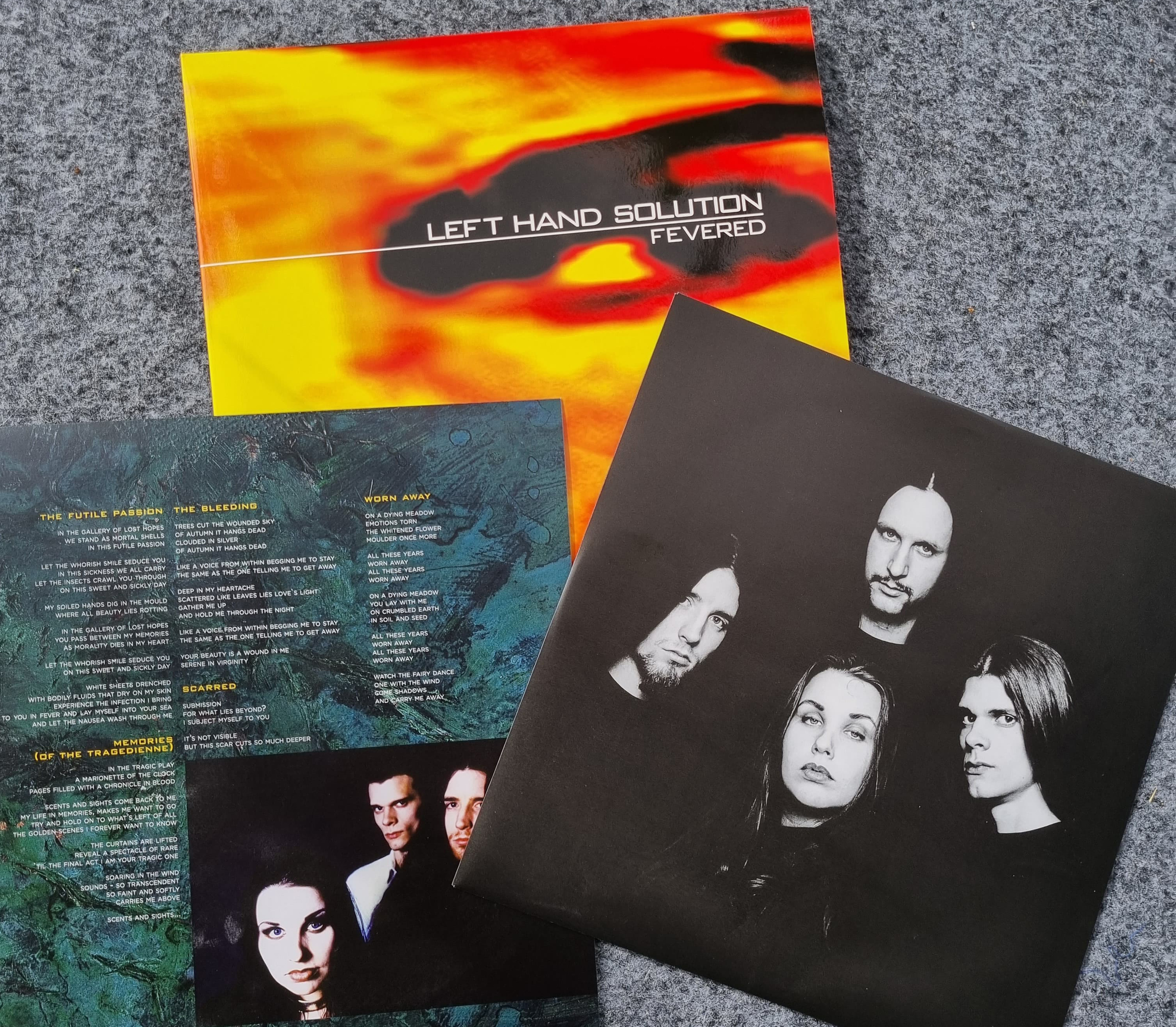 LEFT HAND SOLUTION - Fevered - 25 års jubileumsutgåva (album) genomskinlig orange vinyl  - 3