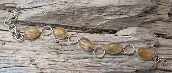 Armband med rutilkvarts oval och mellanringar, förlängningskedja. 925-silver