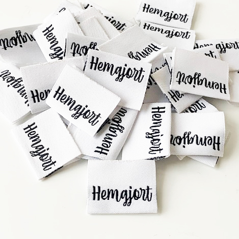 Woven folded label Hemgjort white