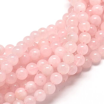 Runda rosenkvartspärlor ca 6 mm på 38 cm sträng med mjuk rosa ton.