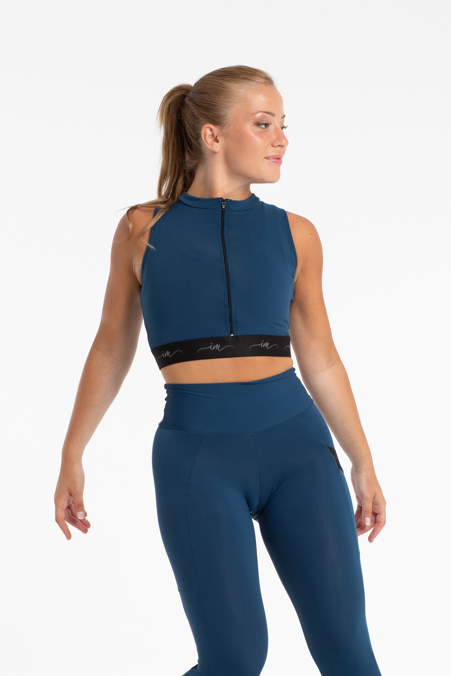 Ärmlös croptop i microfiber med dragkedja 