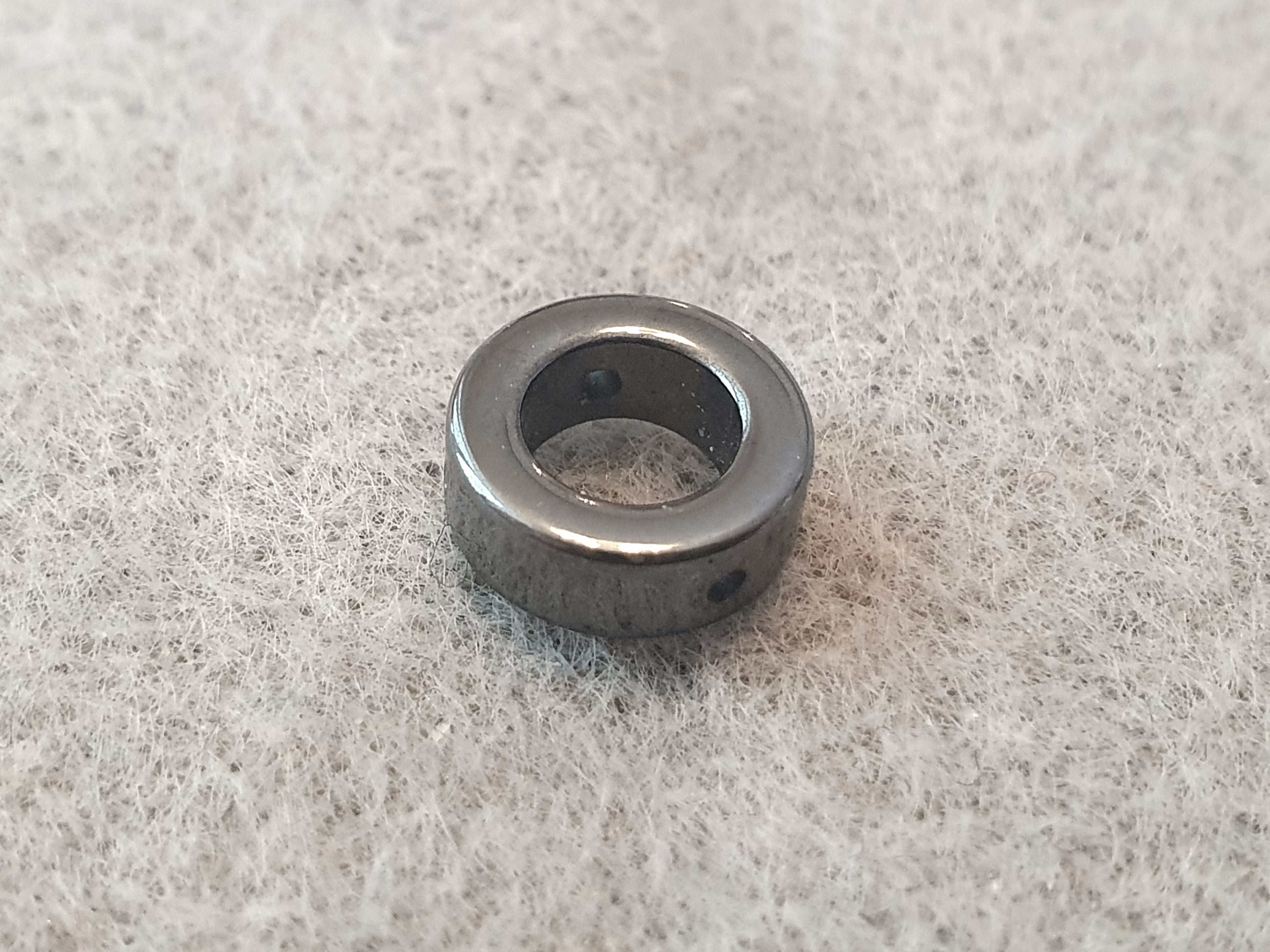 Hematit, cirkel ca. 10mm x 3,7mm  5st/fp Pris/fp ( pressat ) (0,8)