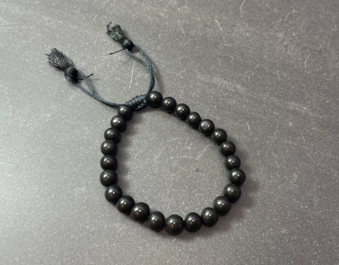 Svart Onyx Mala- armband med tofs
