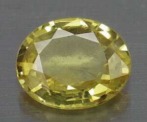 0.45 ct tjusig 5.5x4.7 mm oval slipad naturlig gul safir ädelsten