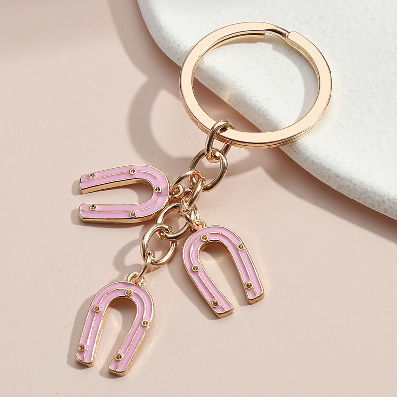 NYCKELRING - hästskor, rosa/guld
