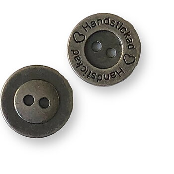 Metallknapp "Handstickad"