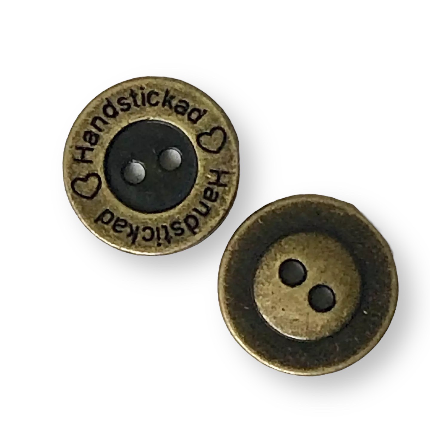 Metallknapp "Handstickad"