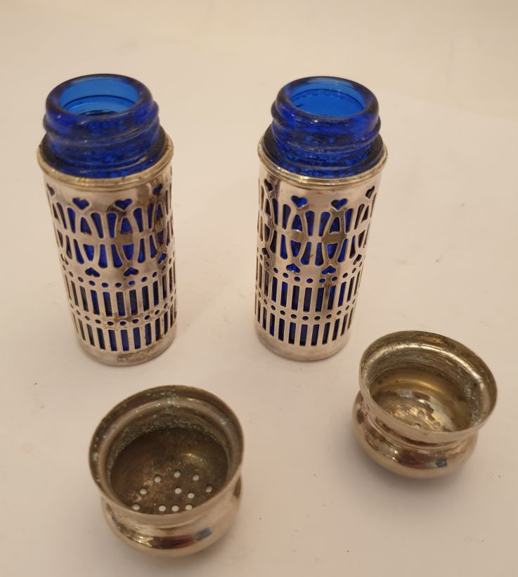 Blue glass salt store and pepper shakers