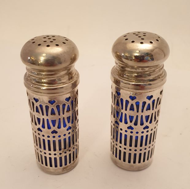 Blue glass salt store and pepper shakers