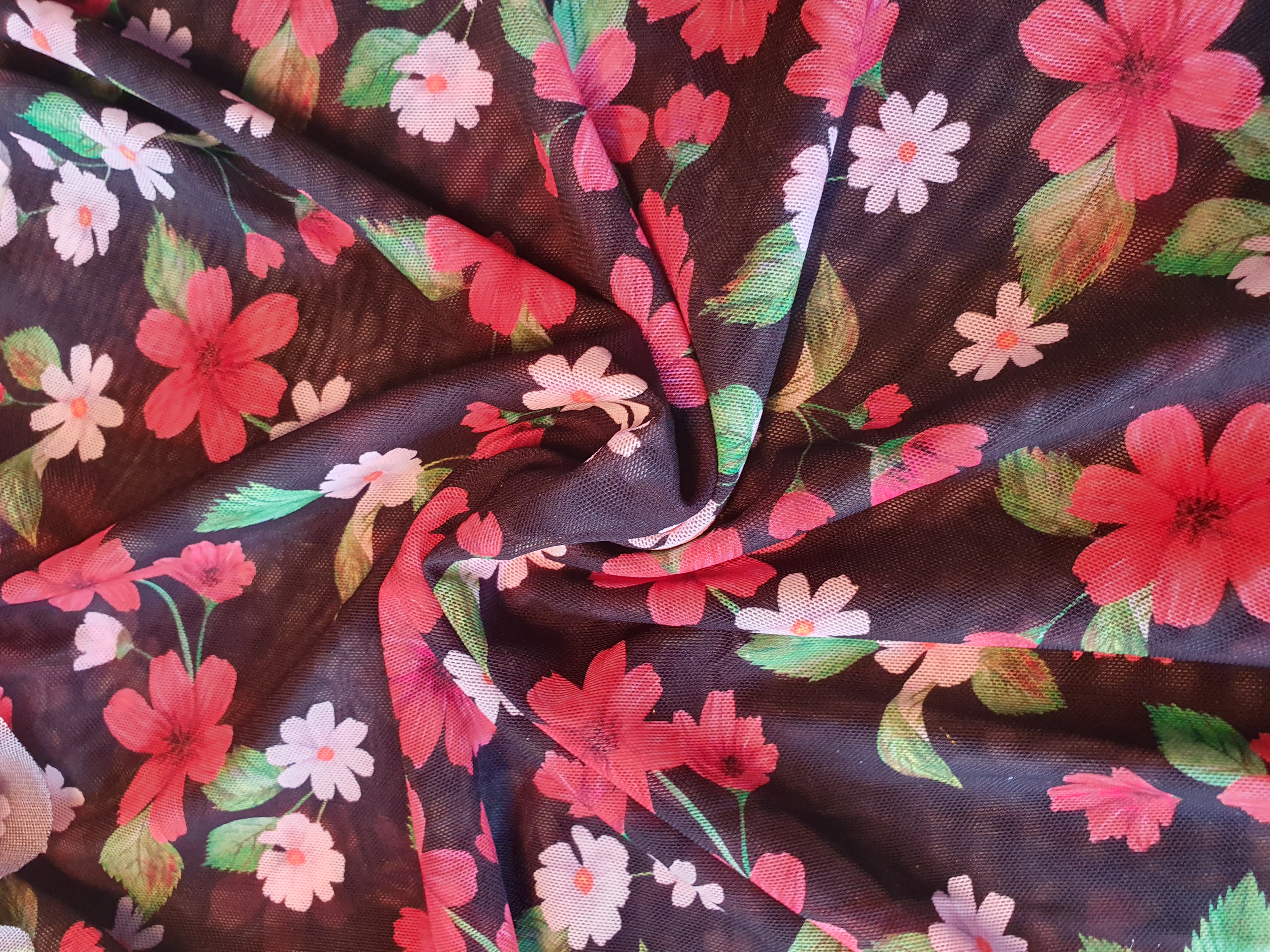 Stretch mesh in black with beautiful red flowers