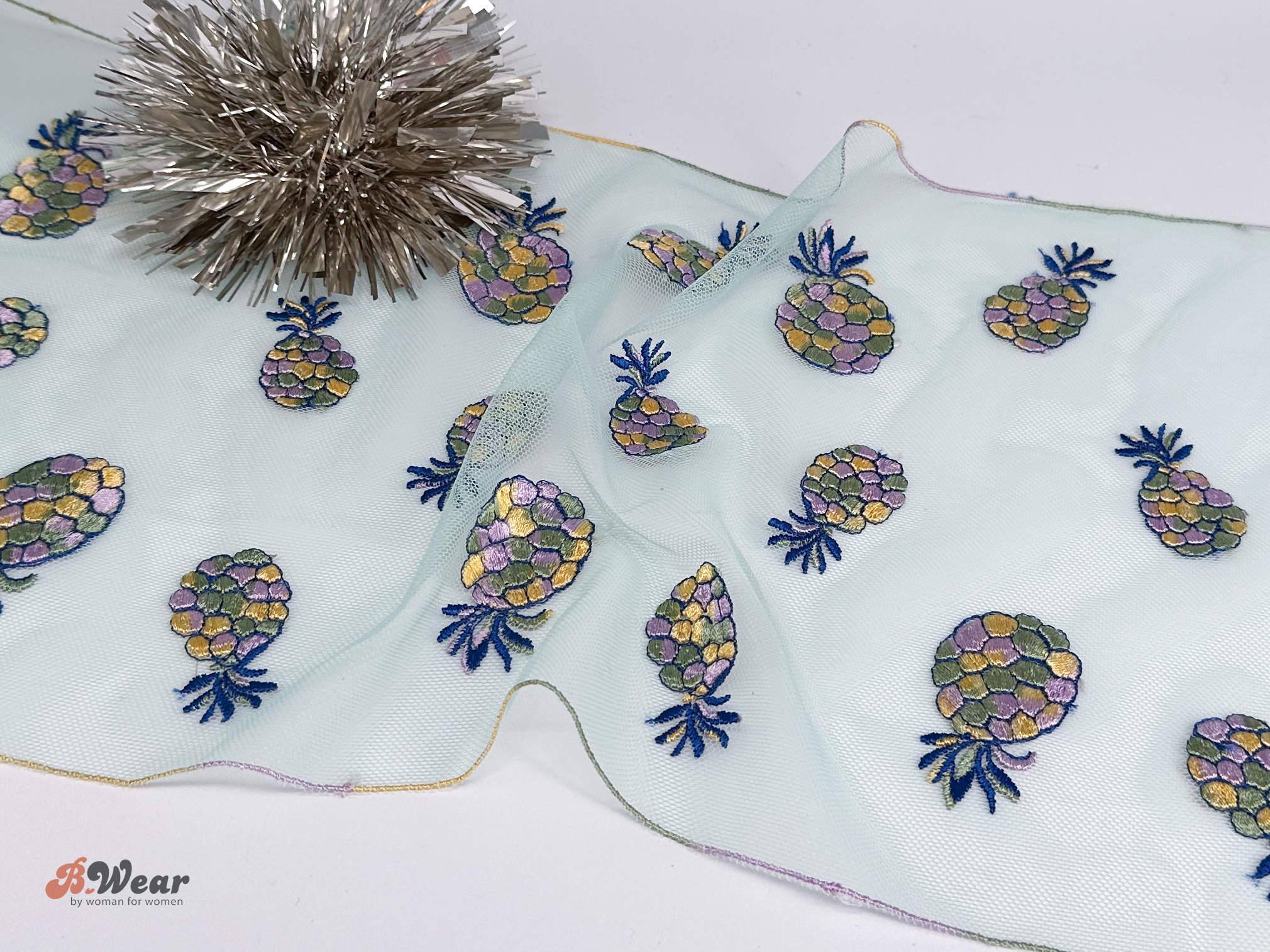 Non-stretch tulle lace in light pistachio green with colorful pineapples - 24 cm