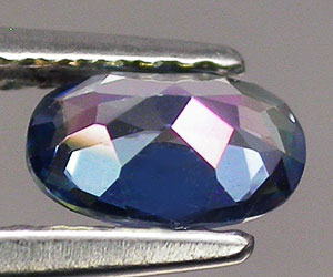 Hermoso topacio azul azotico natural, ovalado, de 6,1x4,1 mm con brillo superior - 2