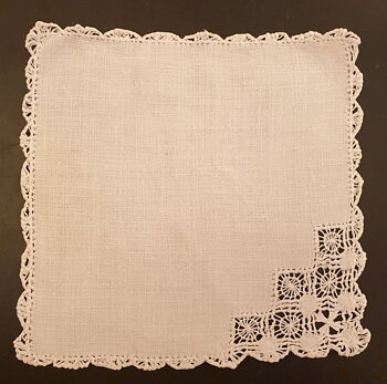Small linen cloth with hole embroidery and thread lace trim