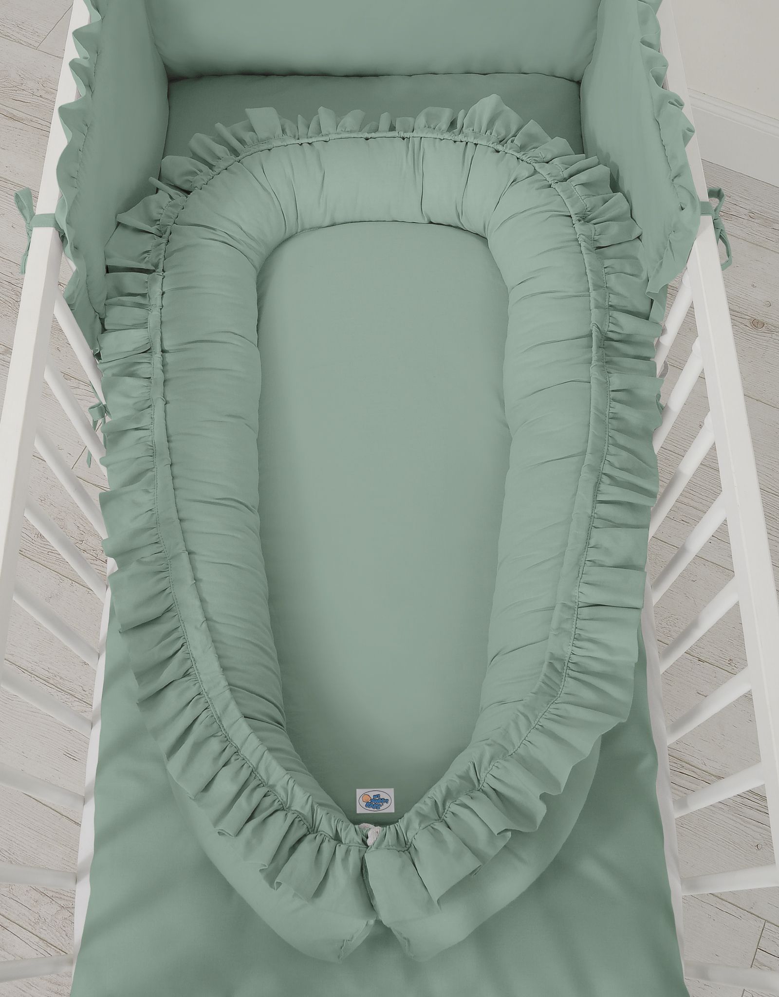 Premium Babynest Cocoon med volanger, Pastellgrön