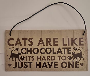 Skylt "Cats are like chocolate..."
