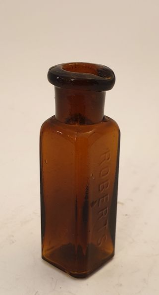 Roberts small medicine bottle with spout amber brown