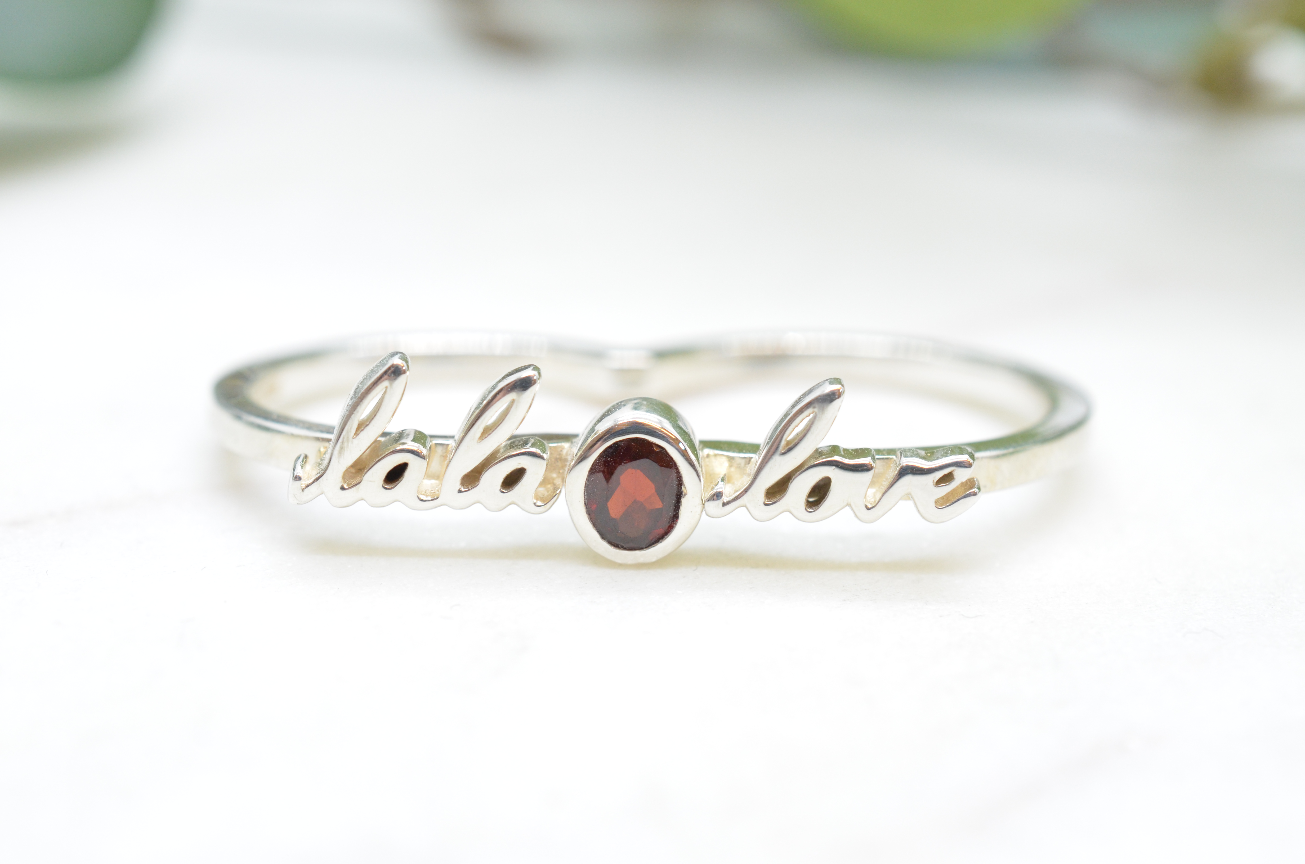 Second Hand Efva Attling "Lala Love" silver ring with red stone.