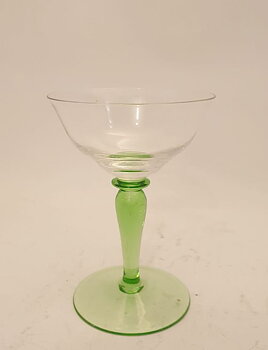 Liqueur glass on light green base