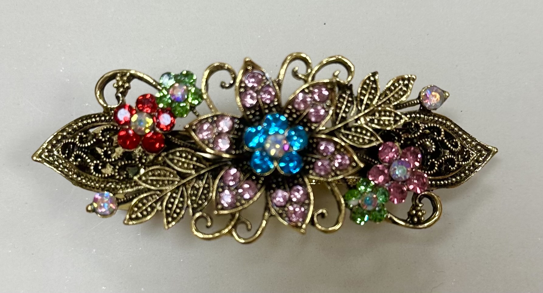 Mässingfärgad klämma med strass- multicolor 