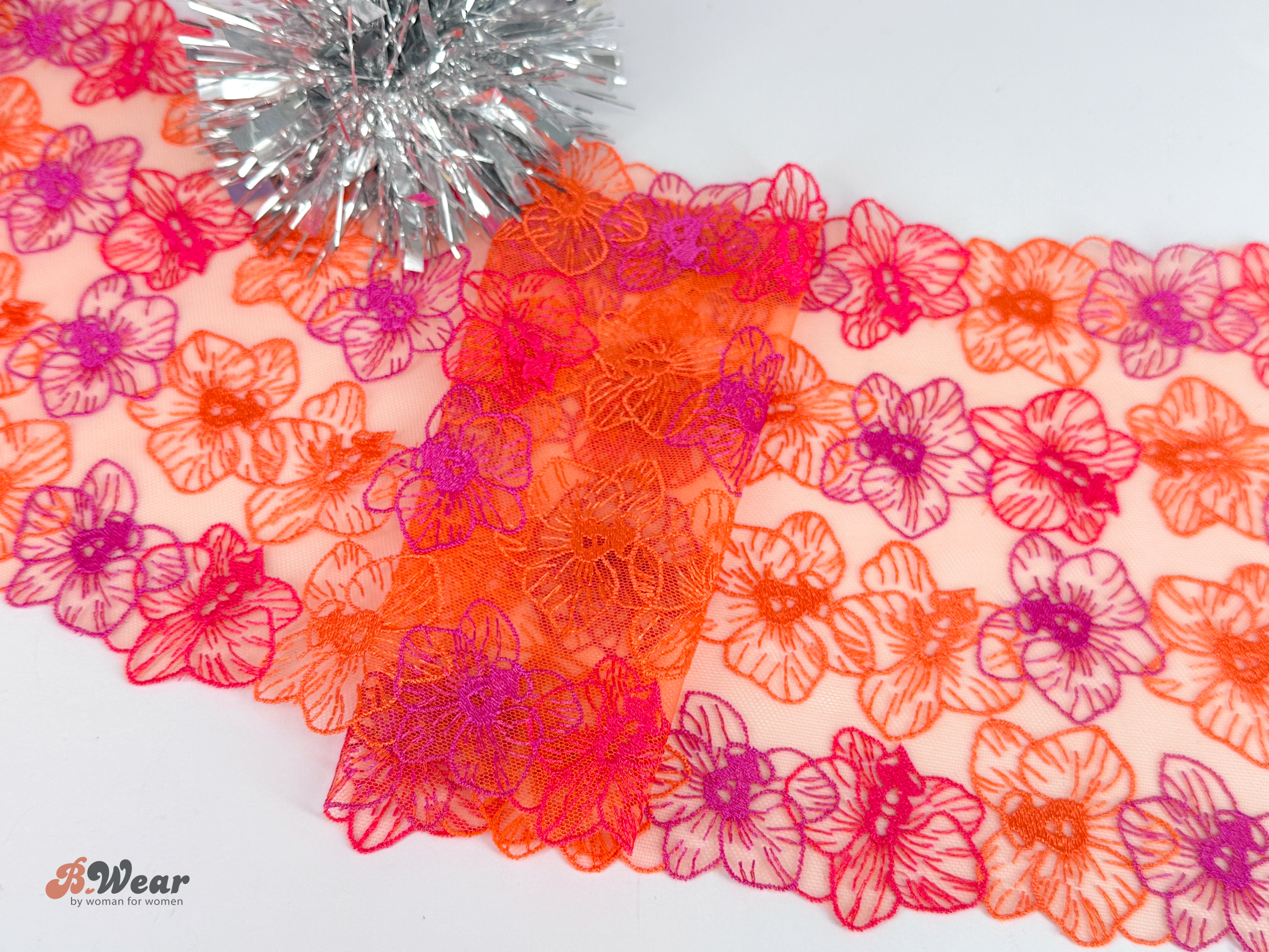 Beautiful non-stretch lace with flowers in orange and fuchsia - 20 cm