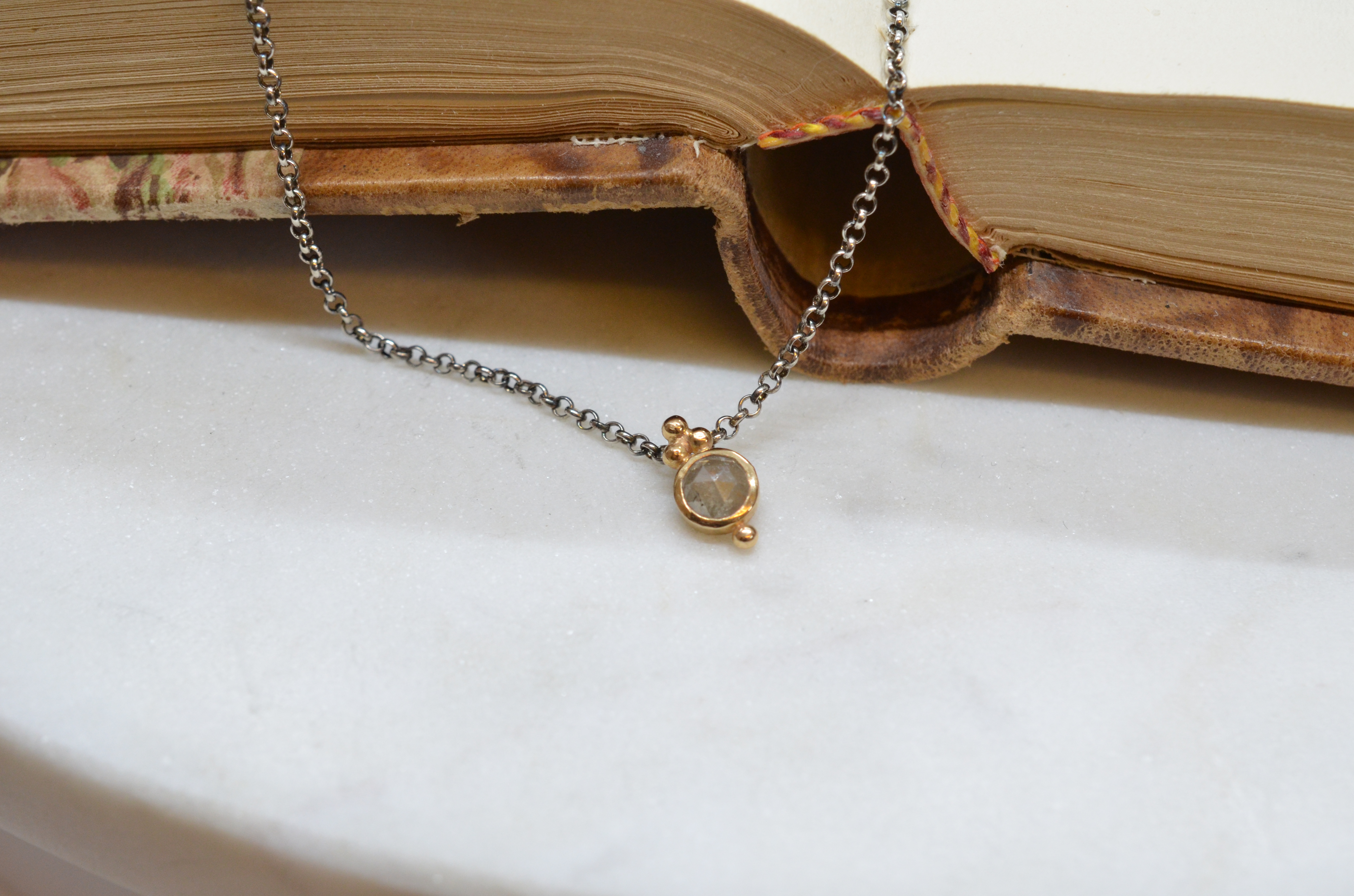 18k diamond pendant on an oxidized silver chain
