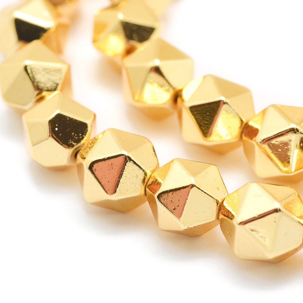 Hematit star cut guld 6 mm, 10 st kantiga syntetiska hematitpärlor med guldfärgad long life-plätering och hål ca 1 mm.