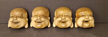Glad Buddha Ansikte handsnidad i trä 