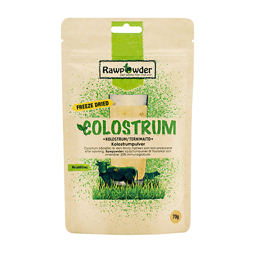 En stående papp-påse med tryck text på där det står colostrum