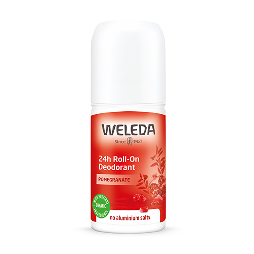 En vit hård plastförpackning med lock och en röd etikett som säger Weleda deodorant pomegranate. 