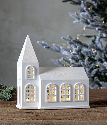 Kyrka med belysning och glitter. Batteridriven