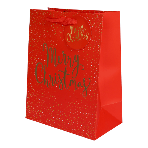 Röd presentpåse med guldfolierad text "Merry Christmas", guldstjärnor och röda handtag – perfekt för julklappar och presenter.